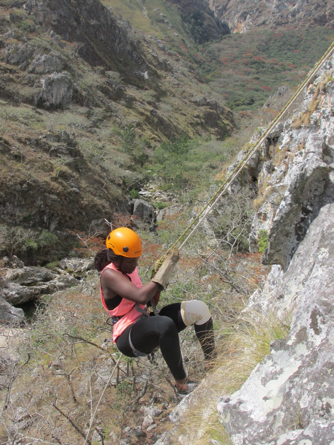 Guest abseiling down a rocky gorge in Chimanimani