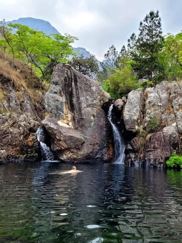 Tiered waterfall cascading through lush Chimanimani forest